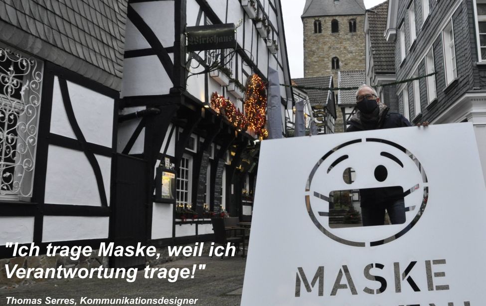 Schablone mit der Aufschrift "Maske Tragen!"